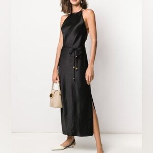 Sexy silhouette, elegant backless and romantic black Nanushka silky dress .
